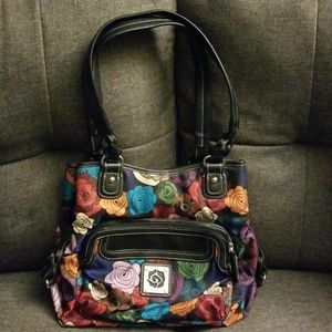 Black purse with multi-colored flowers